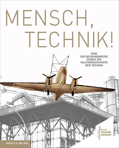Buchcover: helle Schwarzweiß-Ansicht des Neubaus des Deutschen Technikmuseums. Das über der Terrasse hängende Flugzeug ist hervorgehoben mit einer bronzenen Farbe. Darüber steht der Titel des Buches „Mensch, Technik“.